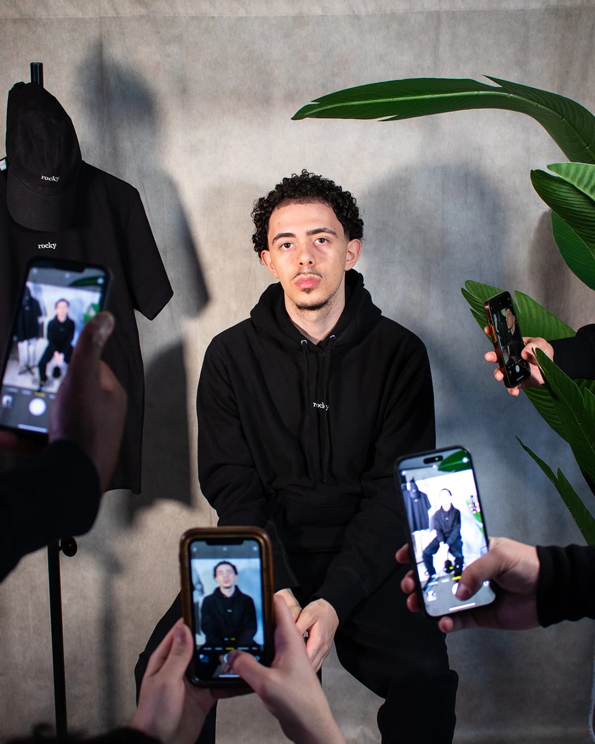 Person from back wearing black crop top and beanie